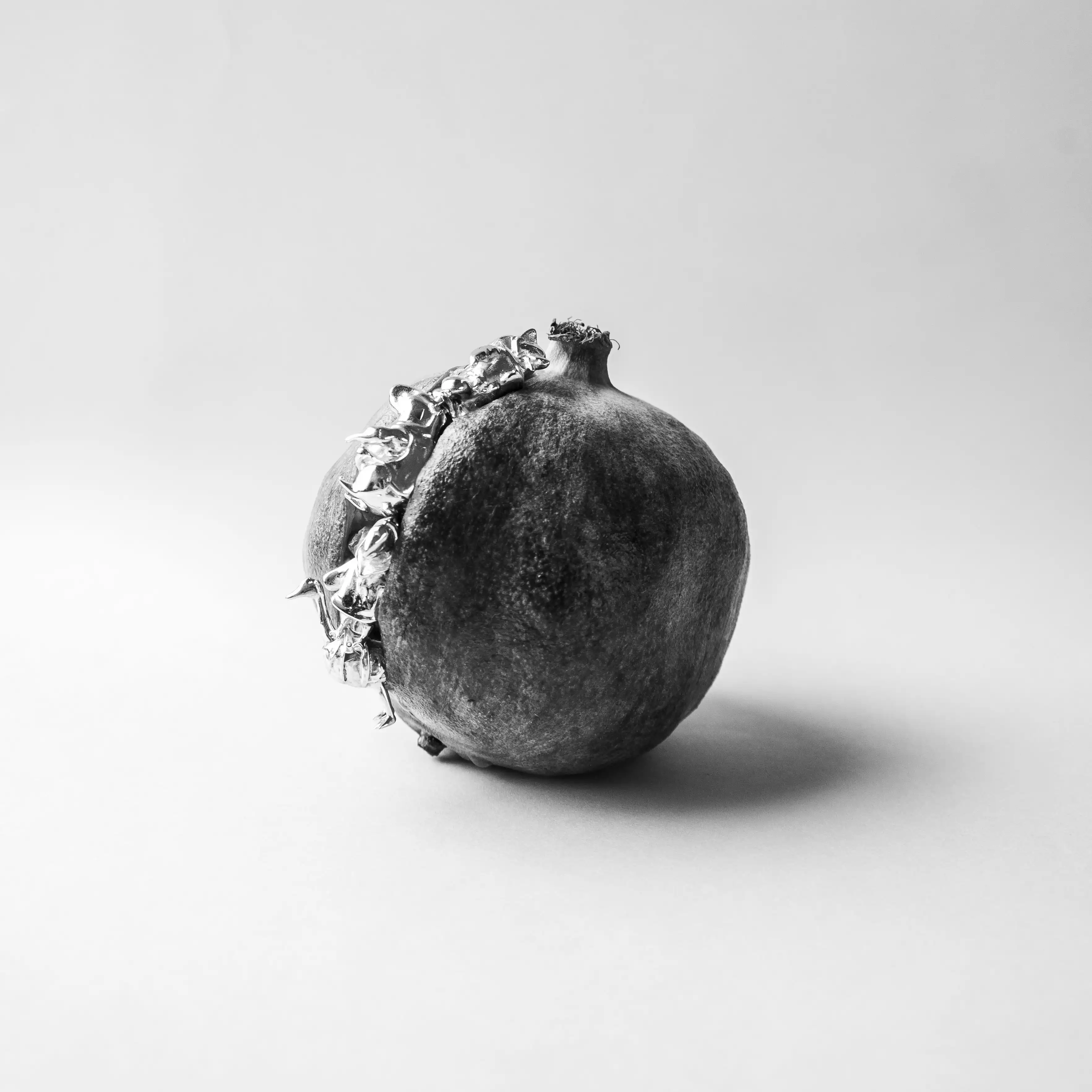 Pomegranate with figurine